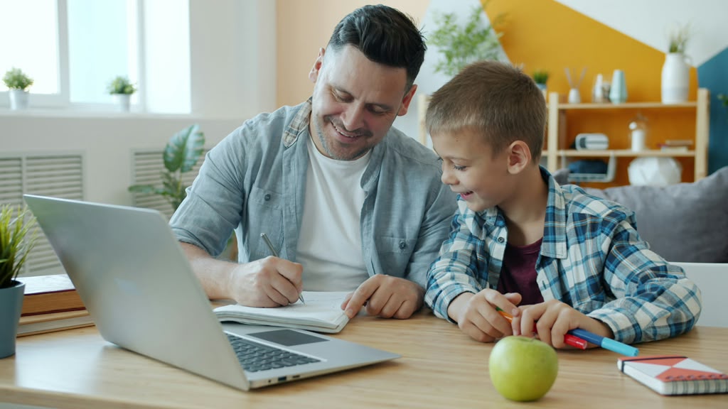 Dad and son writing together